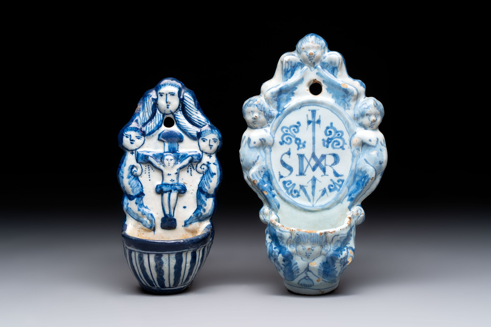 Two blue and white Dutch Delft holy water fonts, 17th C.