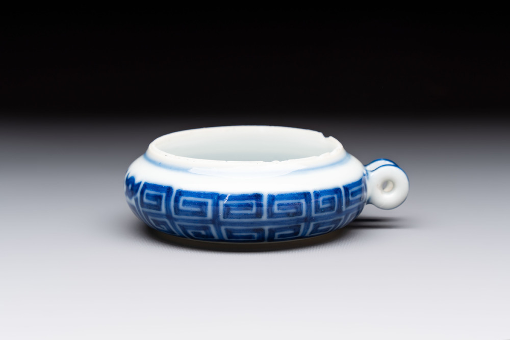 A fine Chinese archaistic blue and white bird feeder with chilong design, Qianlong mark and of the period