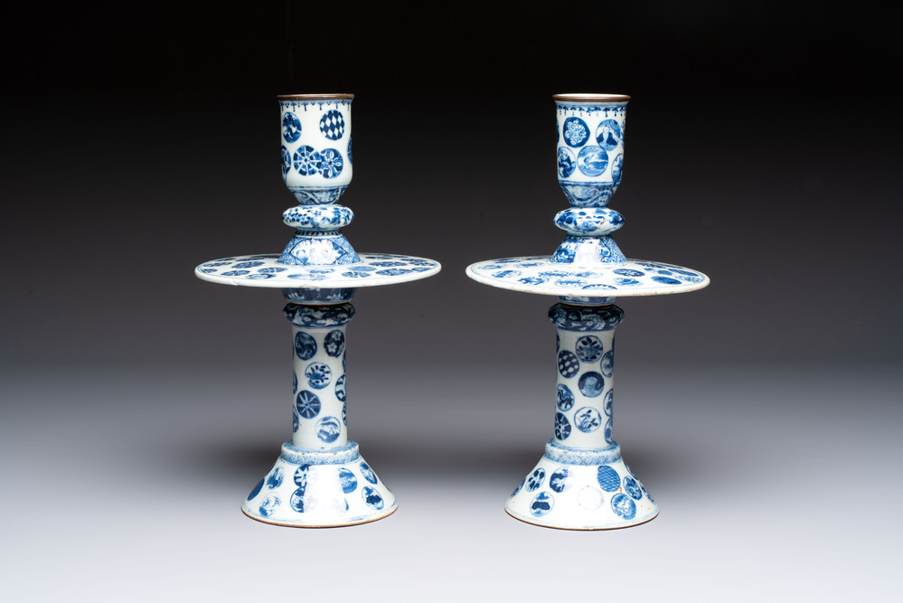 A pair of Chinese blue and white two-piece candle stick holders with brocade ball design for the Southeast Asian market, 19th C.