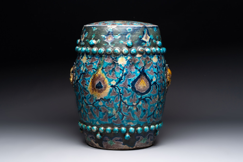 A Chinese Fahua barrel-shaped 'lotus scroll' stool with incised design, Ming