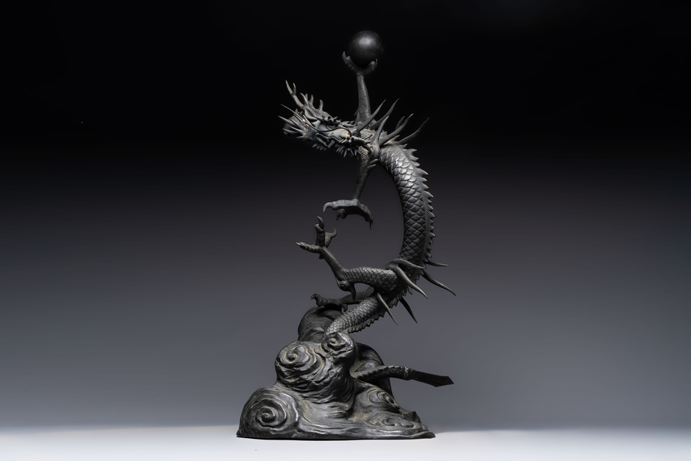 A large Japanese bronze dragon holding a pearl, Meiji, 19th C.