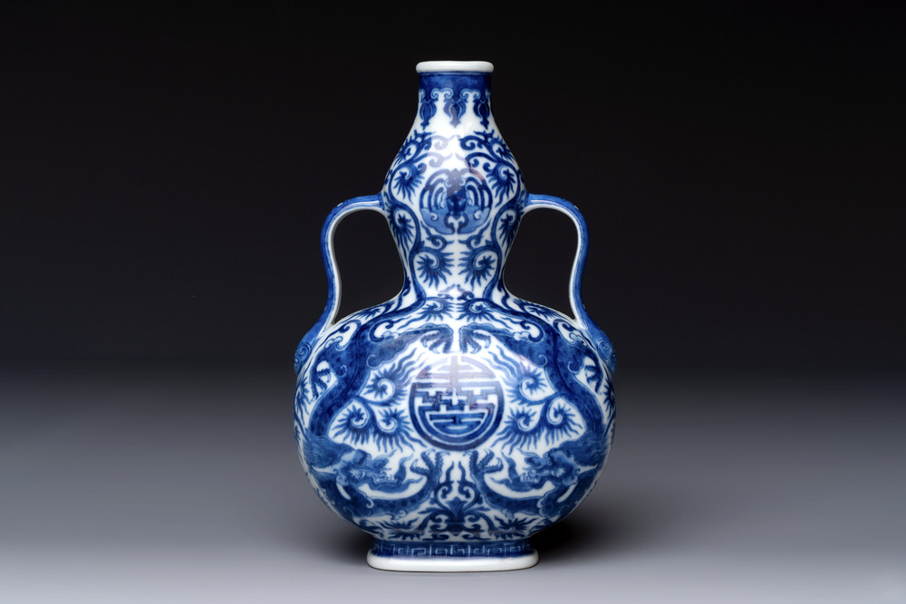 A rare and fine Chinese blue and white double gourd 'dragon' vase with ruyi handles, Qianlong mark and of the period