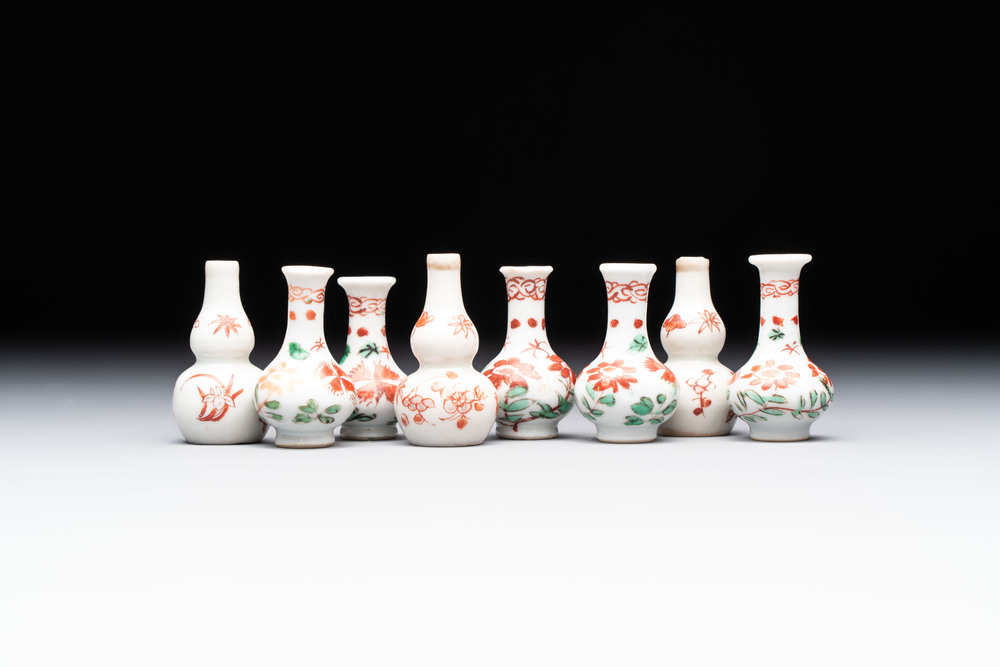 Eight Chinese wucai and gilt-iron-red miniature vases with floral design, Kangxi
