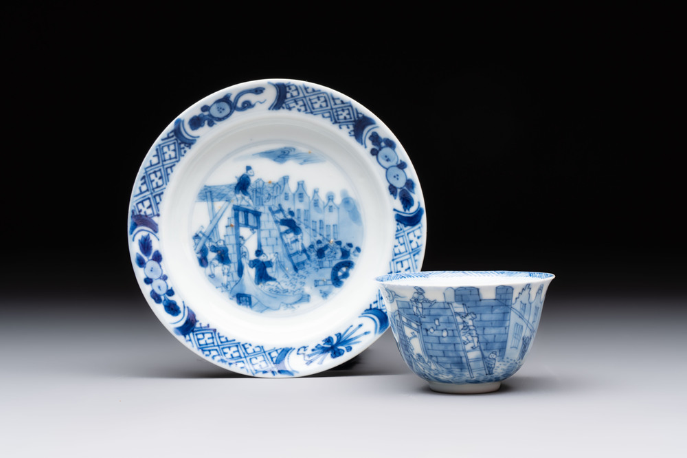 A Chinese blue and white 'Rotterdam Riot' cup and saucer, jade mark, Kangxi