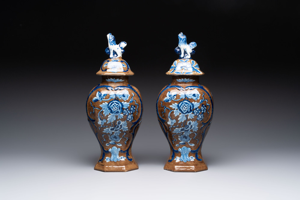 A rare pair of blue and white Dutch Delft brown-ground vases and covers, 18th C.
