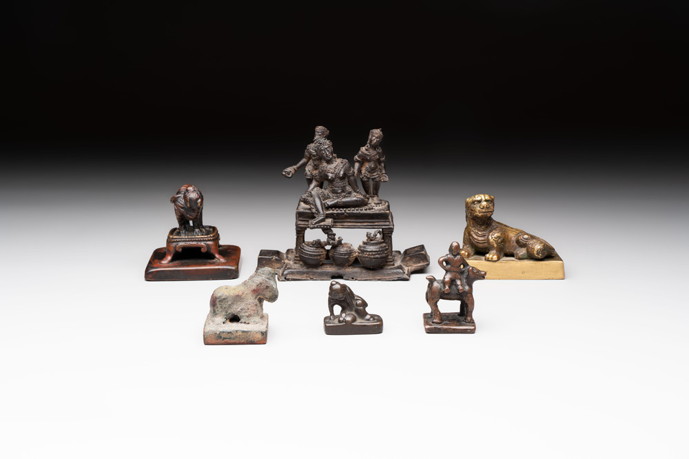 Five Chinese bronze seals and an Indonesian bronze figure group, 18/19th C.