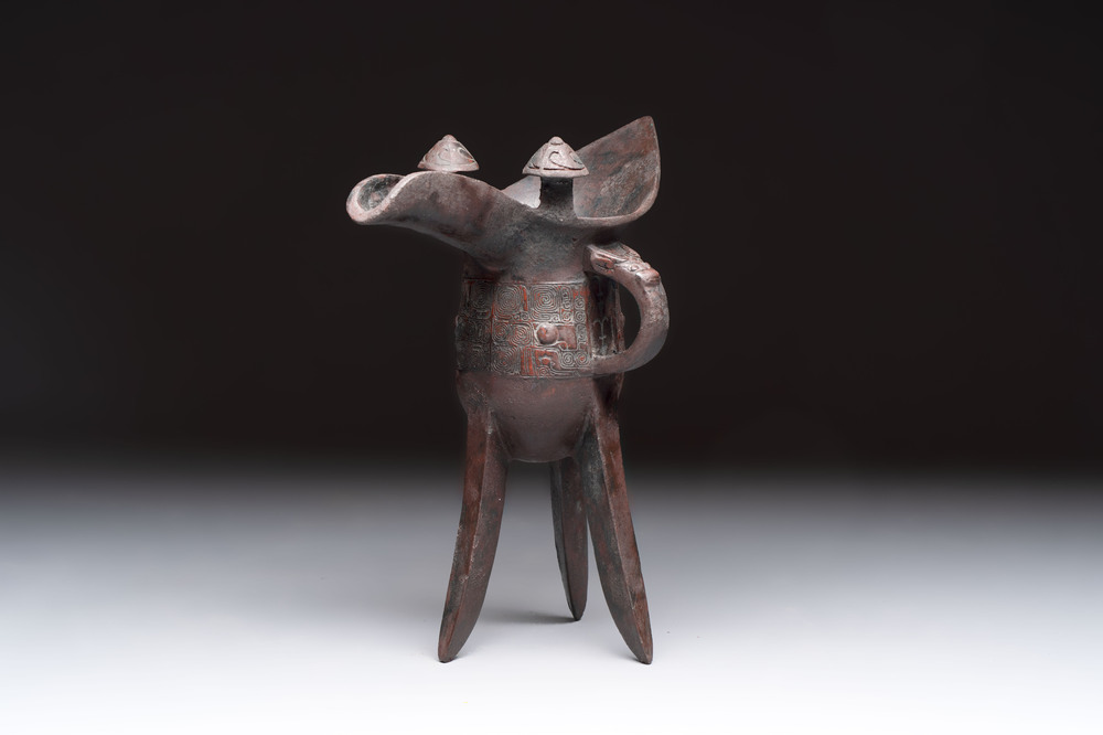 A Chinese archaic bronze wine vessel with Taotie design, 'Jue 爵', Zhou