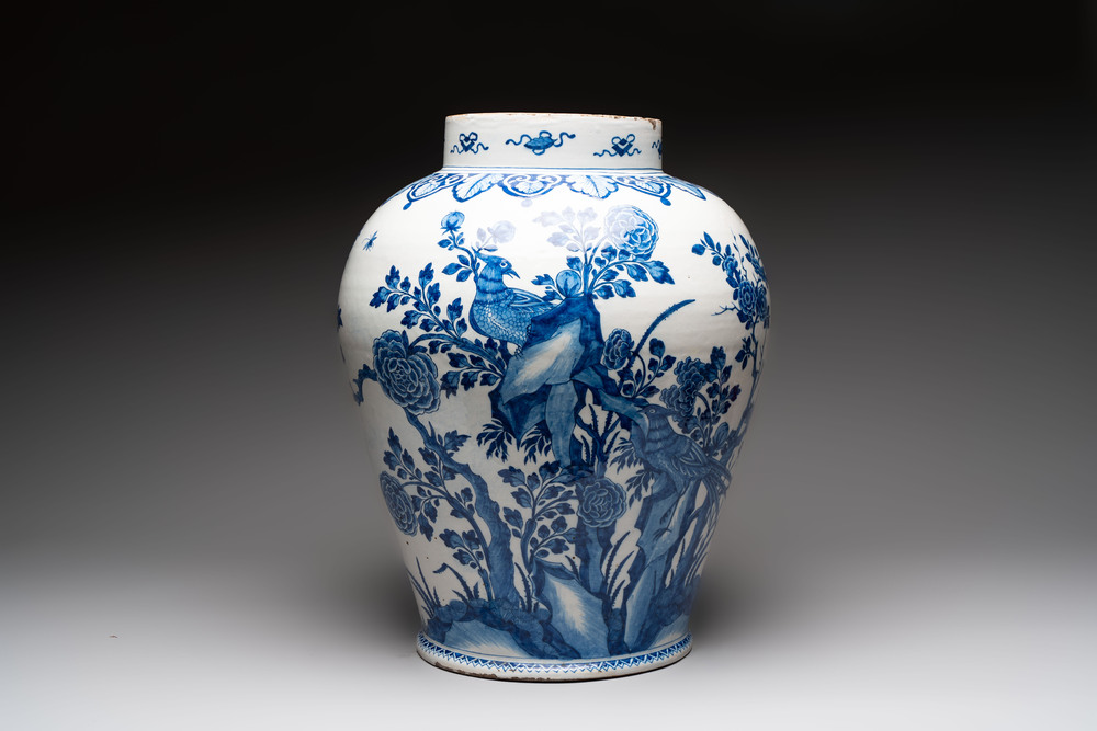 A large blue and white Dutch Delft Kangxi-style chinoiserie 'pheasant among peonies' vase, early 18th C.