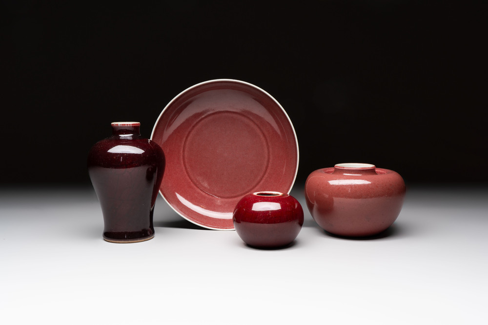 A Chinese copper-red-glazed plate, a meiping vase and two water pots, Kangxi marks, 19/20th C.