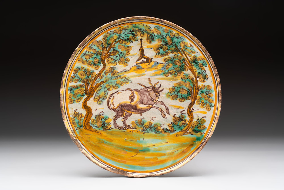 A fine polychrome Spanish pottery tazza with a leaping bull, Talavera, 18th C.