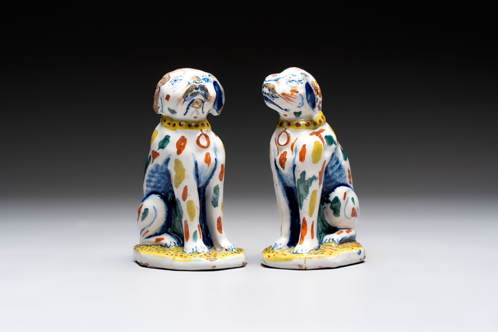 A pair of polychrome Dutch Delft dogs, 18th C.