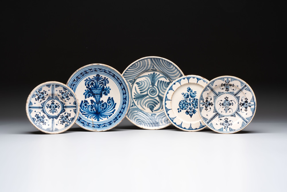 Three blue and white Spanish pottery plates, a dish and a tazza with floral design, Talavera, 19th C.