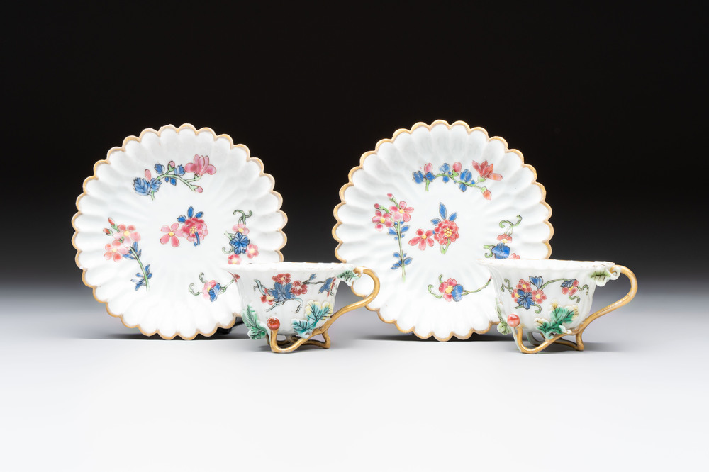 Two Chinese gilt-decorated famille rose cups and saucers with floral design, Qianlong