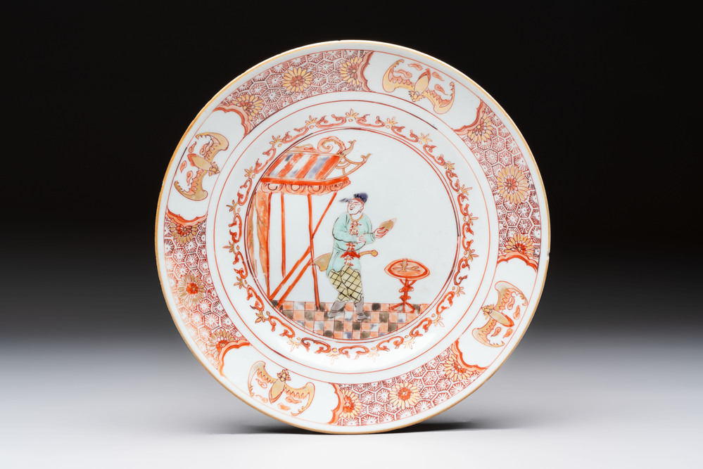 A rare Chinese polychrome 'Commedia dell'arte' 'South Sea Bubble' plate, Yongzheng, ca. 1720-1725