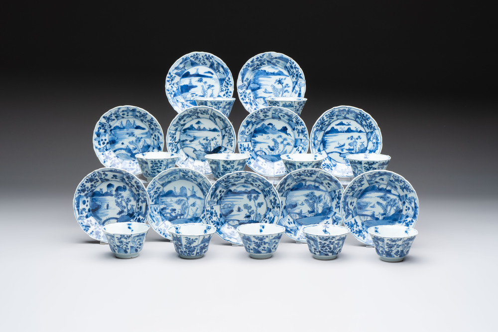 A set of 11 Chinese blue and white cups and saucers with riverscape design, Kangxi