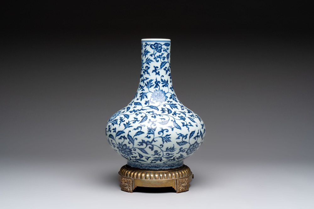 A gilt-bronze-mounted Chinese blue and white bottle vase with floral design, 19/20th C.