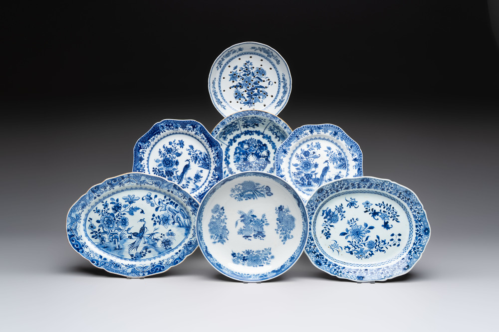 Seven Chinese blue and white plates and dishes with floral design, 18th C.