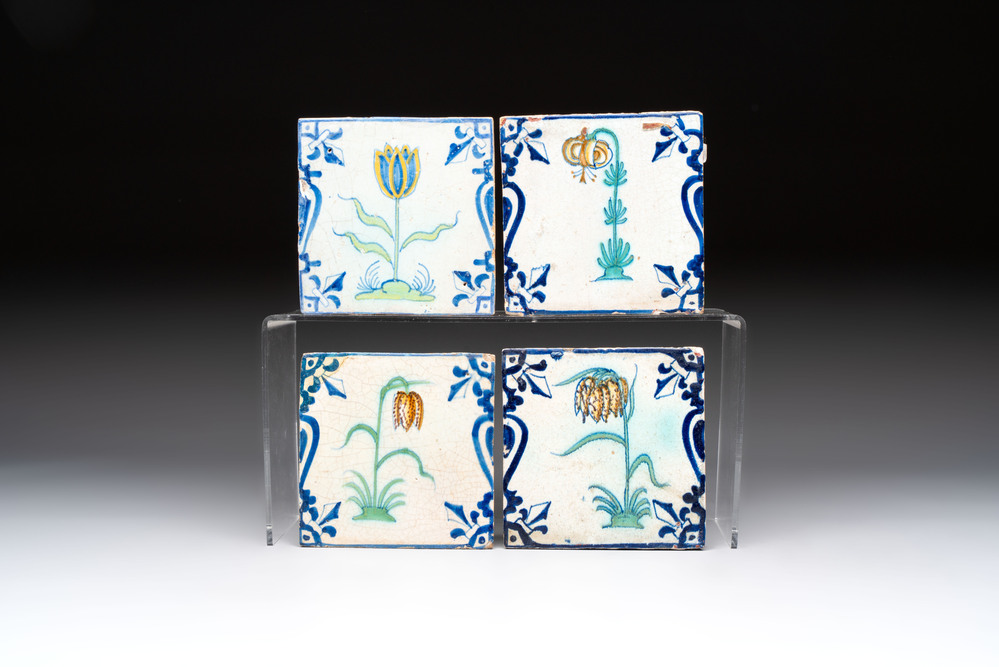 Four polychrome Dutch Delft 'candelabra' tiles with flowers, 17th C.