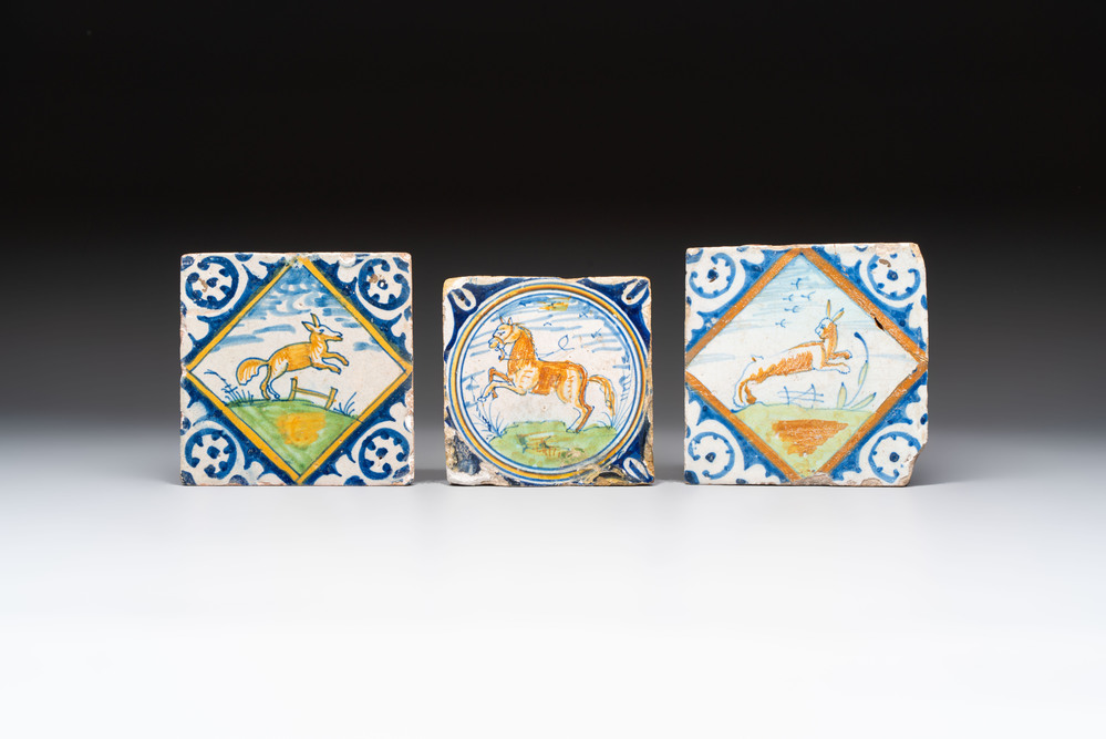 Two polychrome Dutch Delft maiolica 'fox' and 'hare' tiles and a small 'horse' medallion tile, late 16th C.