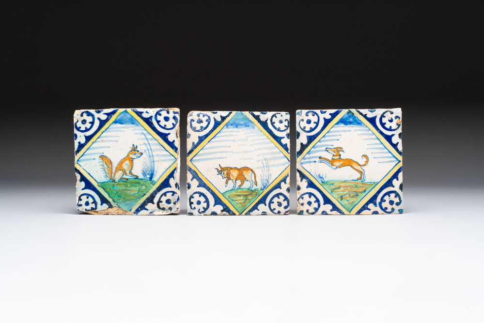 Three polychrome Dutch Delft maiolica 'fox', 'bull' and 'dog' tiles, late 16th C.