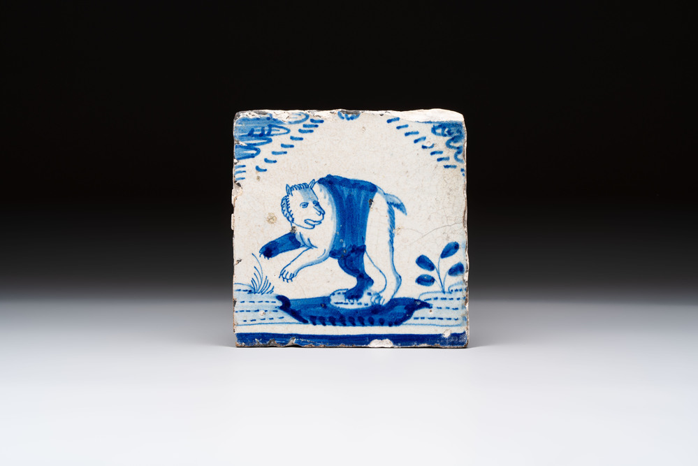 A blue and white Dutch Delft 'crown' 'bear' tile, Rotterdam, early 17th C.