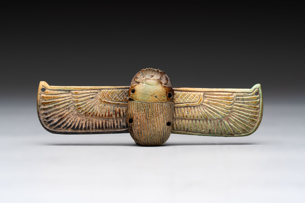 An Egyptian turquoise-glazed composition winged scarab, Ptolemaic, 4/1st C. B.C.