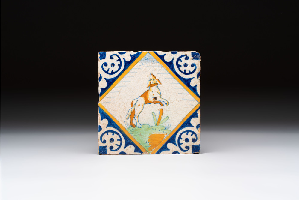 A polychrome Dutch Delft maiolica 'dog' tile, late 16th C.