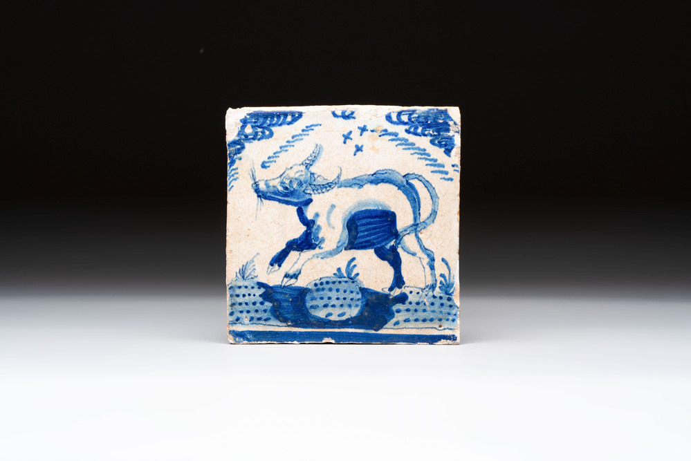 A blue and white Dutch Delft 'crown' 'ox' tile, Rotterdam, early 17th C.