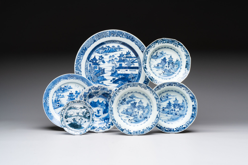 Six Chinese blue and white plates and a dish with landscape design, 18th C.