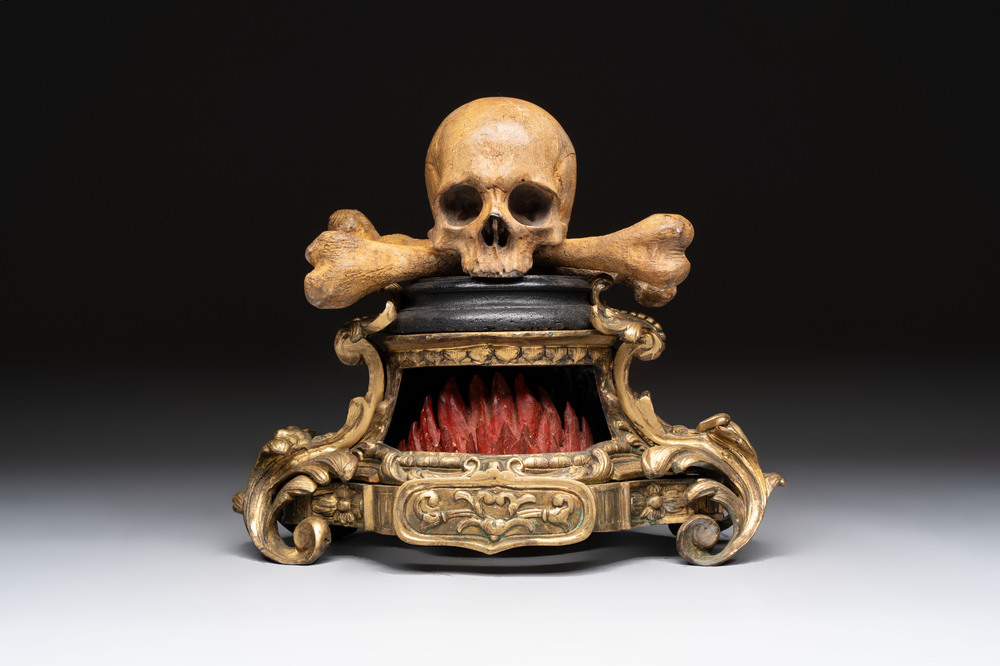An Italian 'vanitas' or 'memento mori' skull with wooden crossbones on gilt-bronze base, 18/19th C.