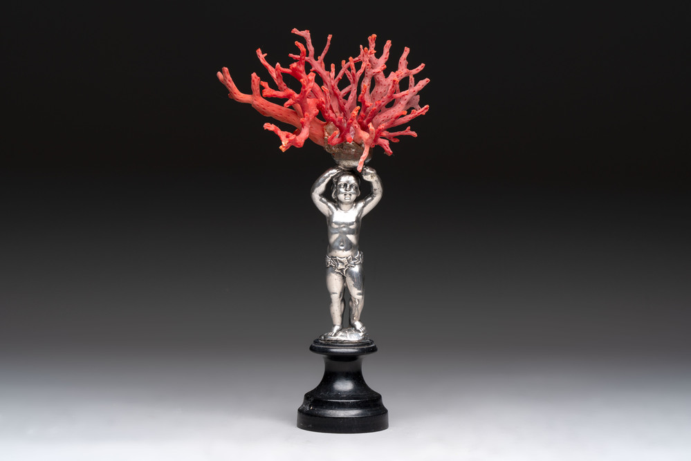 A red coral mounted silver figure, possibly Germany, 19th C.