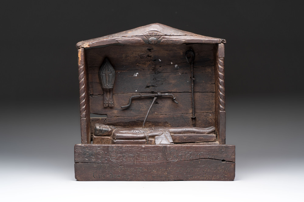 A carved wooden religious shrine depicting the martyrdom of Saint Erasmus of Formia, Germany, 17/18th C.