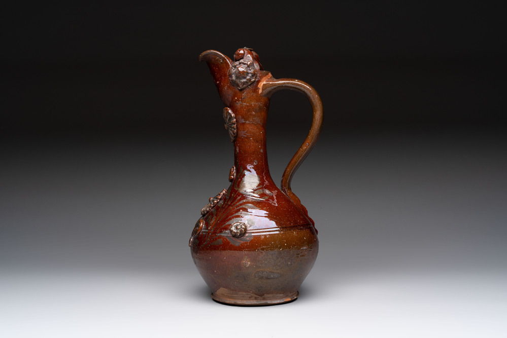 An Ottoman Canakkale pottery ewer with applied floral rosettes, Turkey, 19th C