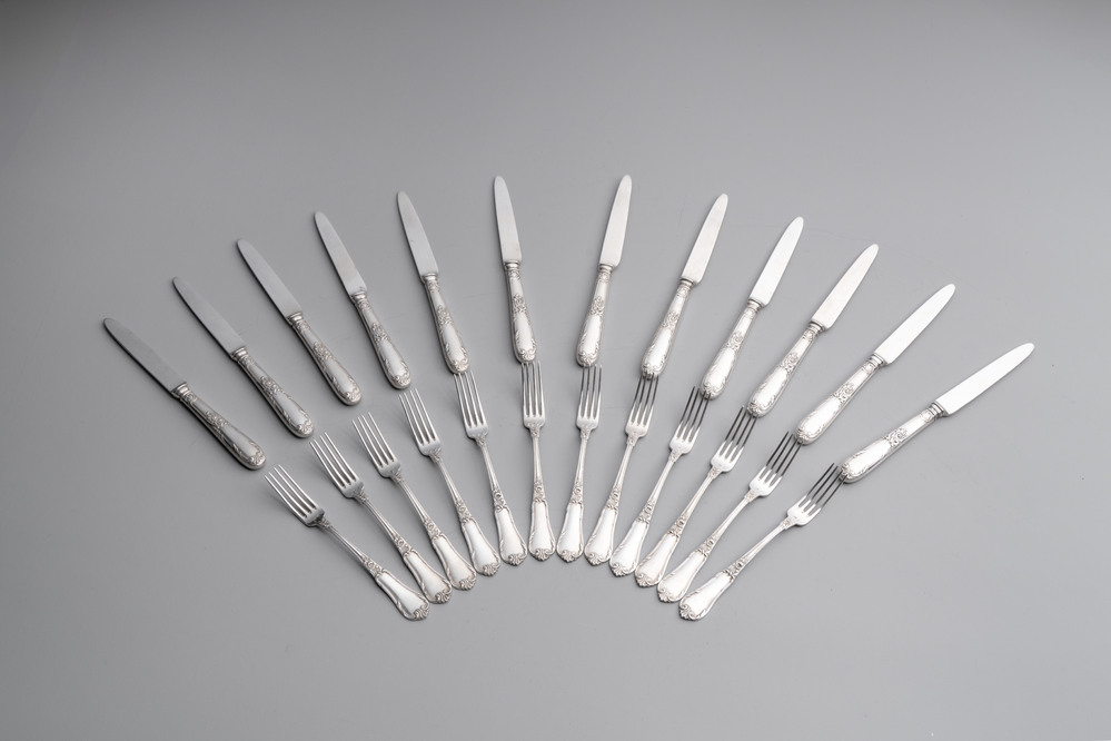 A set of 12 silver dessert forks and dessert knives, 835/000, Wolfers Fr&egrave;res, Brussels, 20th C.