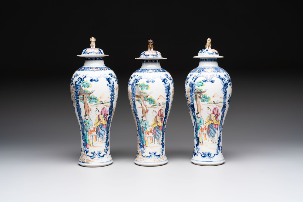 Three Chinese famille rose 'mandarin subject' vases and covers, Qianlong