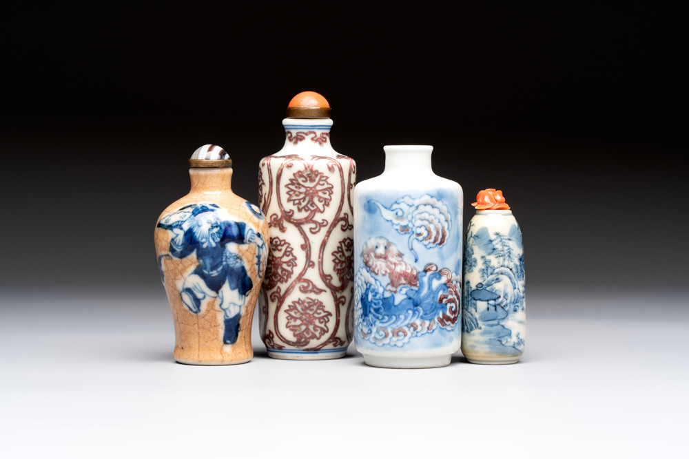 Two Chinese blue, white and copper-red snuff bottles and two blue and white snuff bottles, 19th C.