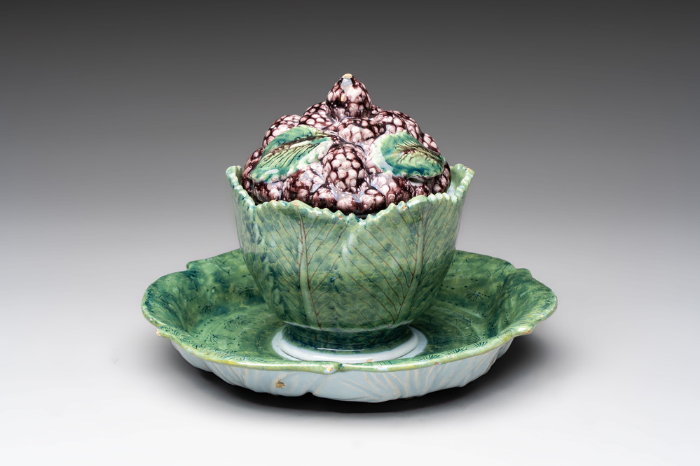 A polychrome Dutch Delft 'mulberries' tureen and cover on stand, 18th C.