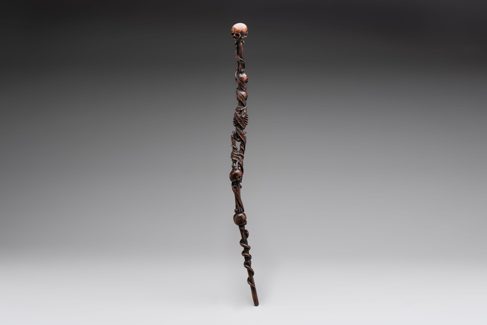 A finely carved boxwood 'vanitas' or 'memento mori' stick, 18/19th C.