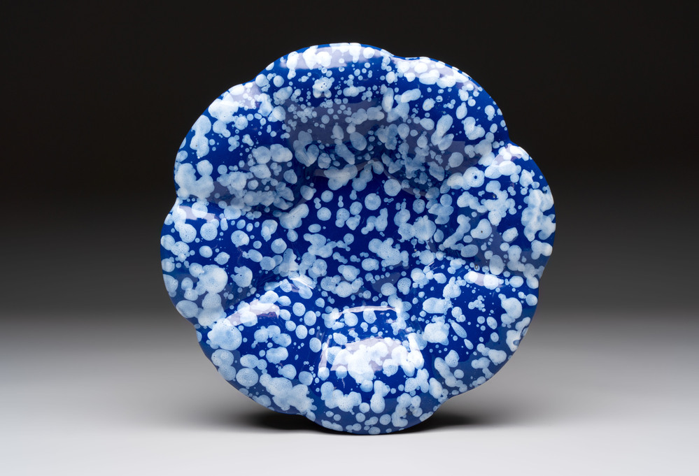 A Nevers white-splashed blue-ground '&agrave; la bougie' dish, France, late 17th C.