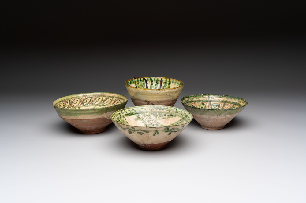 Four Amol pottery sgraffito bowls, Persia, 12th C.