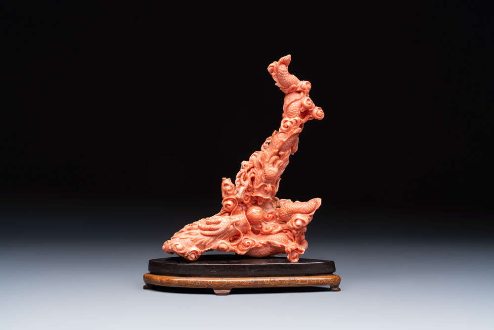 A Chinese carved red coral 'dragon' group, 19/20th C.