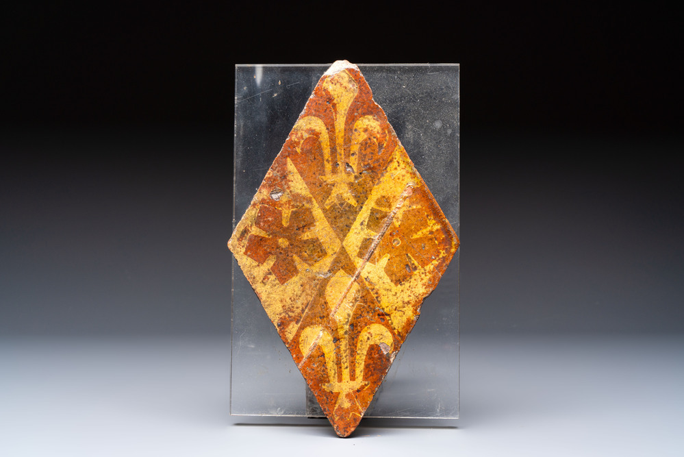 A medieval lozenge-shaped 'Fleur-de-Lys' tile, Chateau de Beaut&eacute;, France, 14th C.