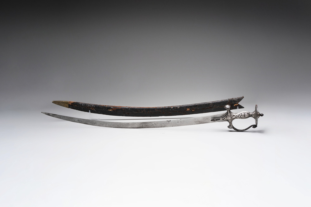 A fine Mughal silver-damascened tulwar with scabbard, India, 19th C.