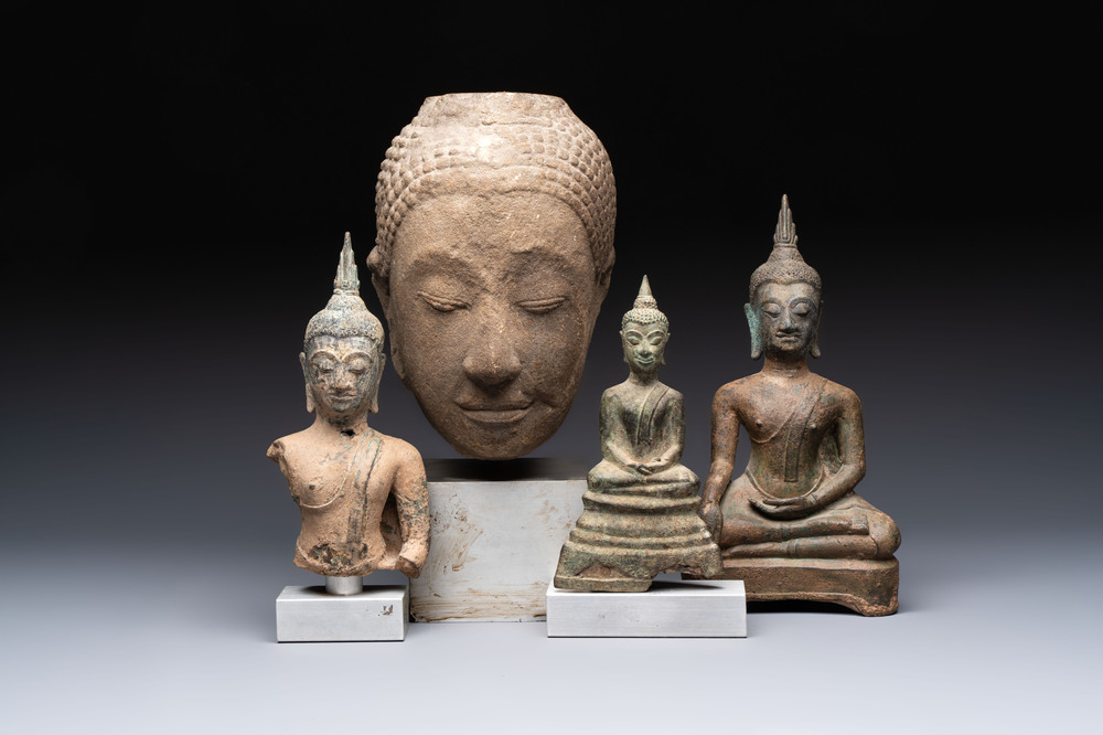 Three Southeast Asian bronze Buddhas and a stone head of Buddha, 18th C.