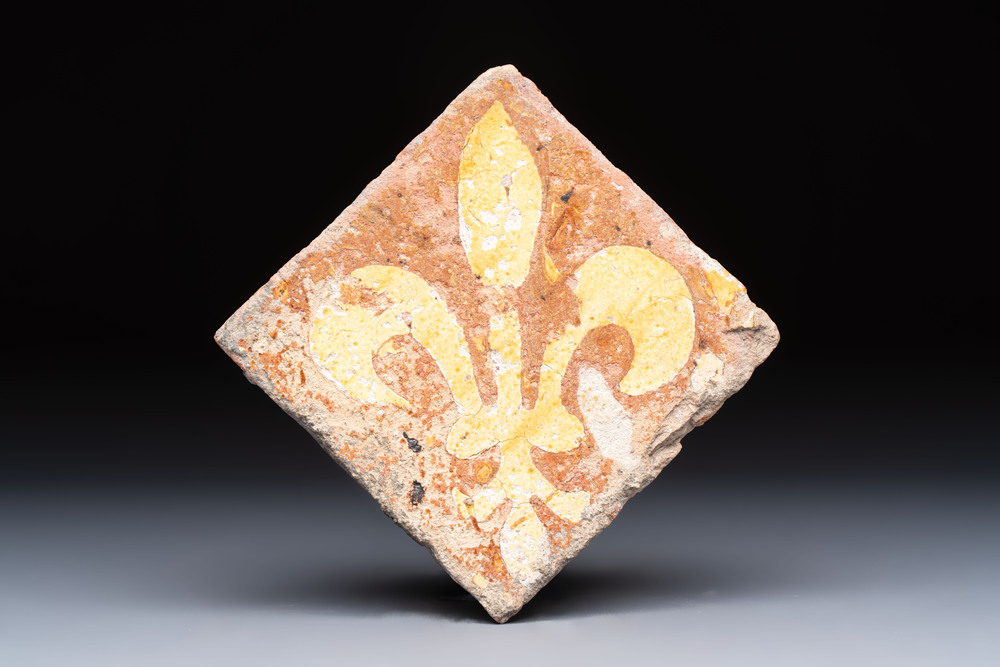 A medieval slip-decorated &lsquo;Fleur-de-Lys&rsquo; tile, probably France or Flanders, 14th C.