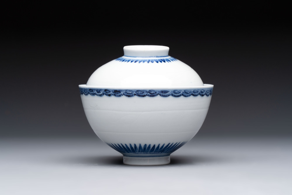 A Chinese blue and white covered bowl with incised floral design, Yongzheng/Qianlong