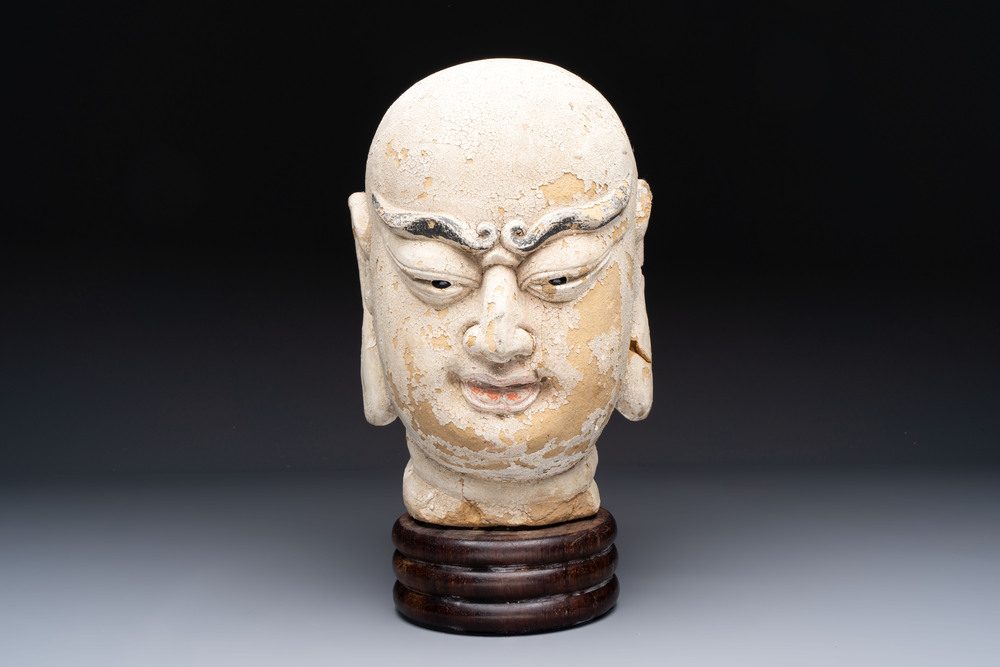 A Chinese stucco head of a Luohan, Qing