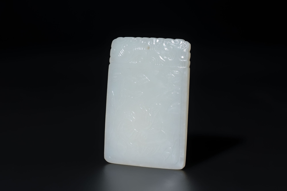A Chinese white jade 'two sages beneath a pine tree' plaque, Zigang 子岡 mark, Qianlong