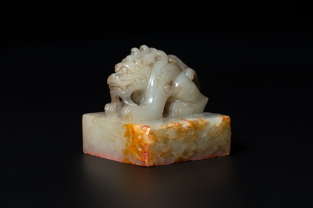 A Chinese celadon and russet jade 'dragon' seal, 18/19th C.