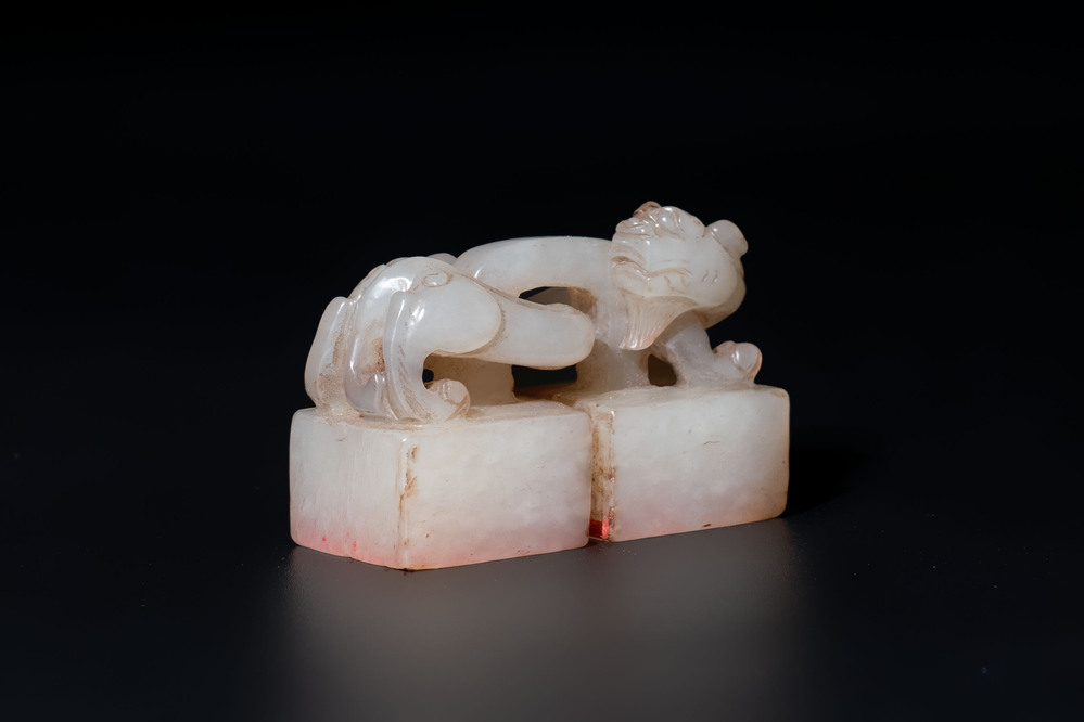 A Chinese celadon and russet jade 'chilong' seal, 18/19th C.